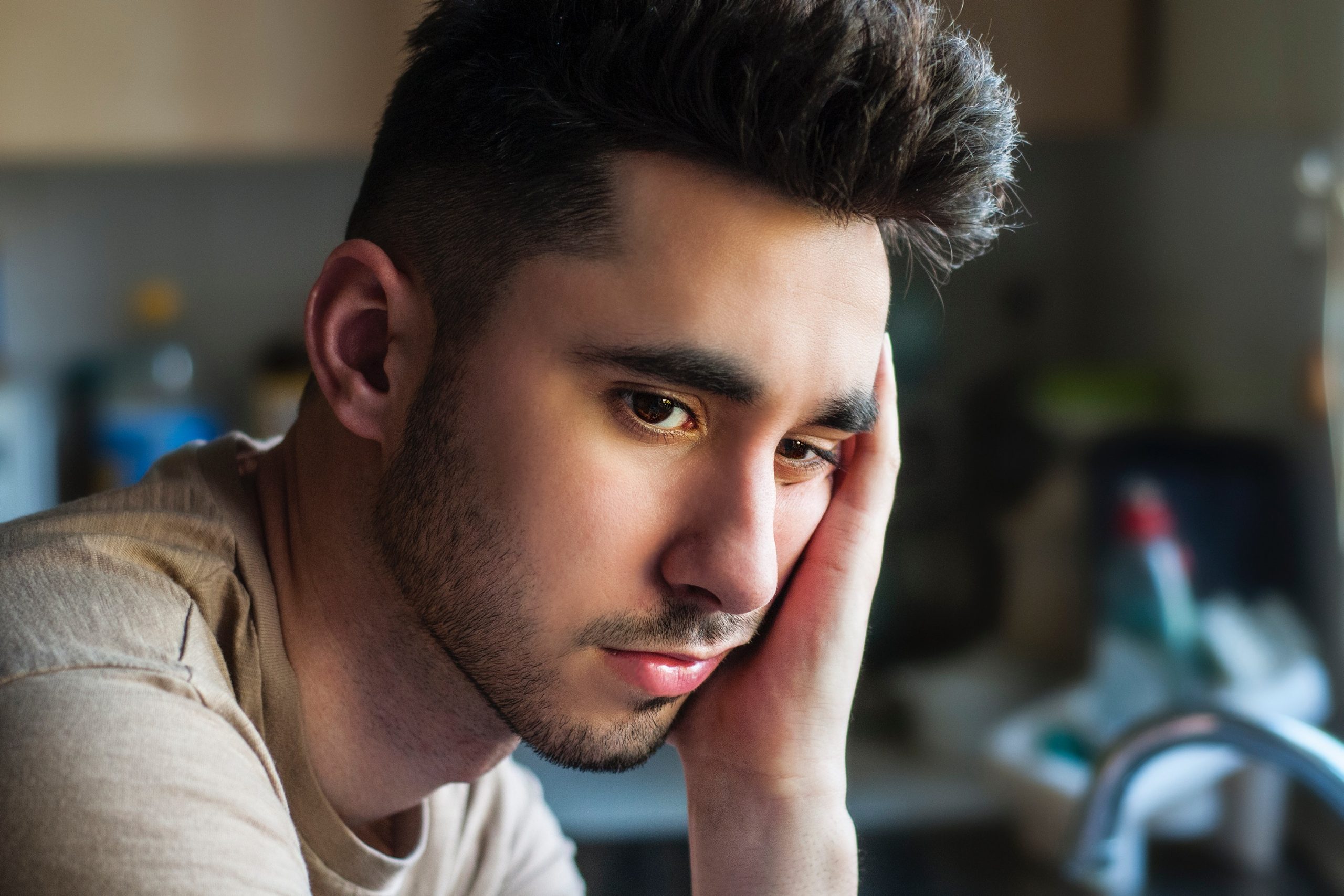 Photo of an anxious male teen due to Covid prior to online anxiety treatment for teens in IL